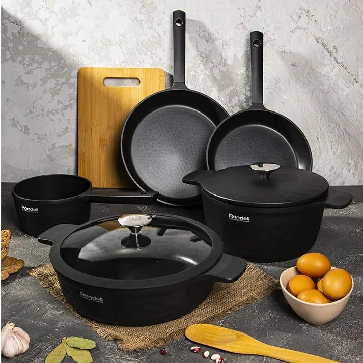 Cast iron cooking vessels